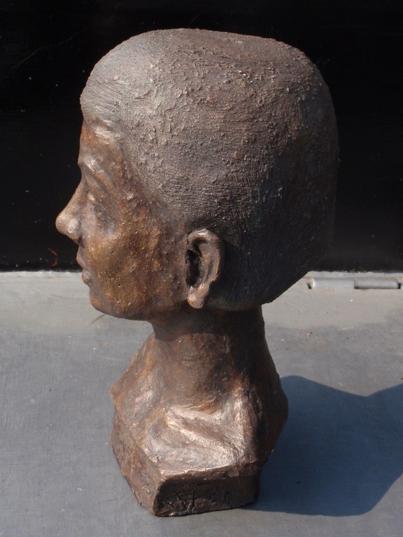 Portrait of woman in clay 1950