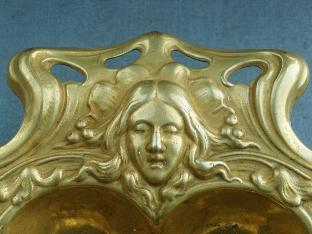 Gilded copper art nouveau dish with floral motifs and female heads 1900