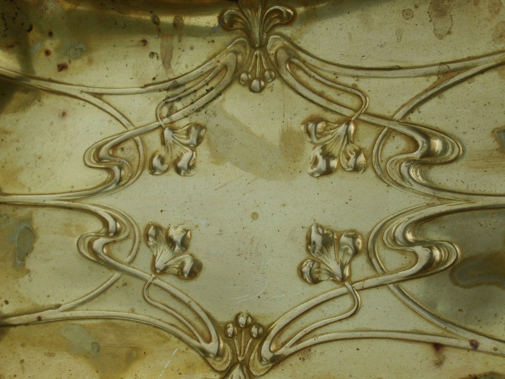 Gilded copper art nouveau dish with floral motifs and female heads 1900