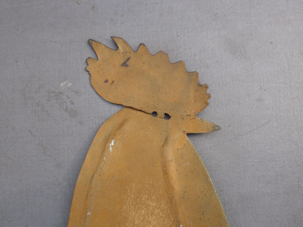 Vintage weather vane in the shape of a cock